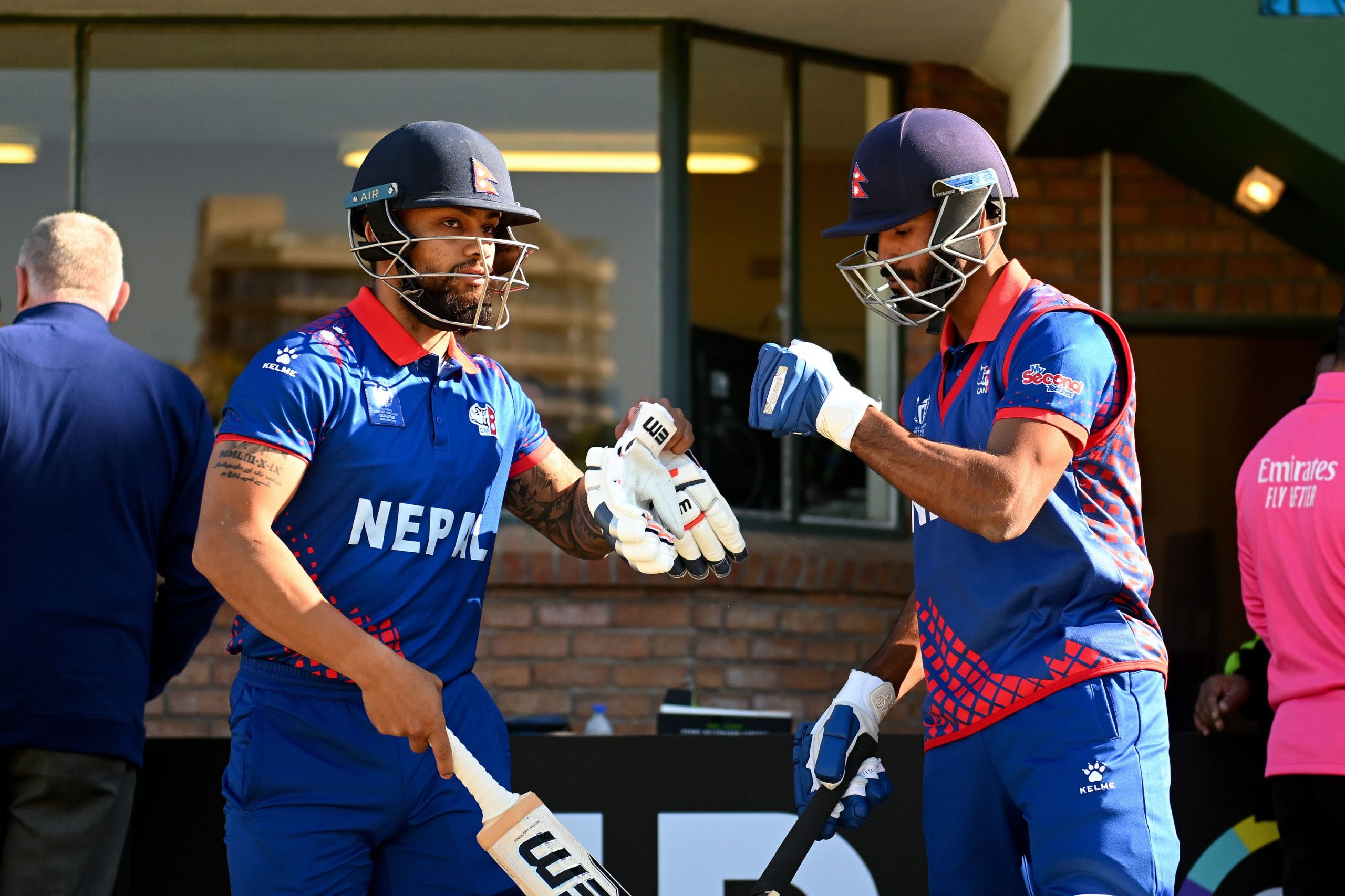 HARARE, ZIMBABWE - JUNE 18: Aasif Sheikh and Kushal Bhurtel bump gloves as they prepare to bat prior to the ICC Men's Cricket World Cup Qualifier Zimbabwe 2023 match between Zimbabwe and Nepal at Harare Sports Club on June 18, 2023 in Harare, Zimbabwe. (Photo by Johan Rynners-ICC/ICC via Getty Images)