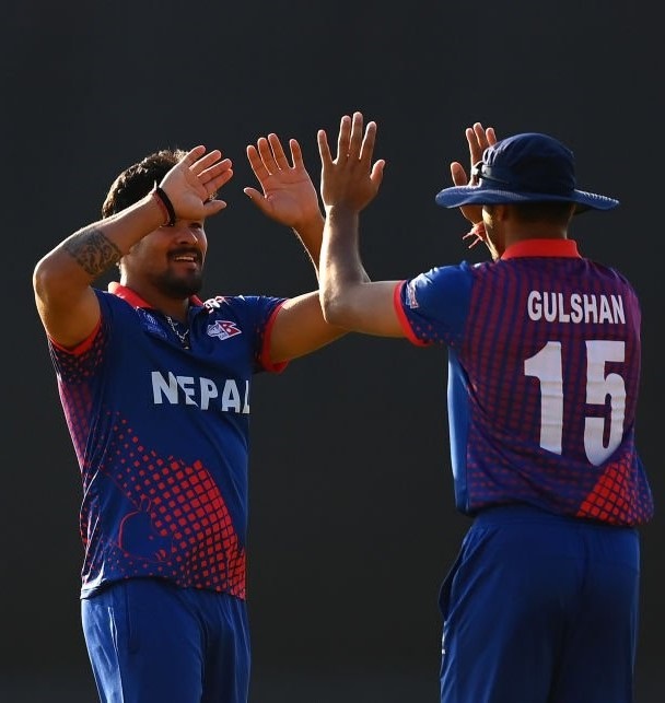 HARARE, ZIMBABWE - JULY 04: Karan KC of Nepal celebrates the wicket of Curtis Campher of Ireland with team mate Gulsan Jha during the ICC Men's Cricket World Cup Qualifier Zimbabwe 2023 Playoff match between Ireland and Nepal at Takashinga Cricket Club on July 04, 2023 in Harare, Zimbabwe. (Photo by Alex Davidson-ICC/ICC via Getty Images)