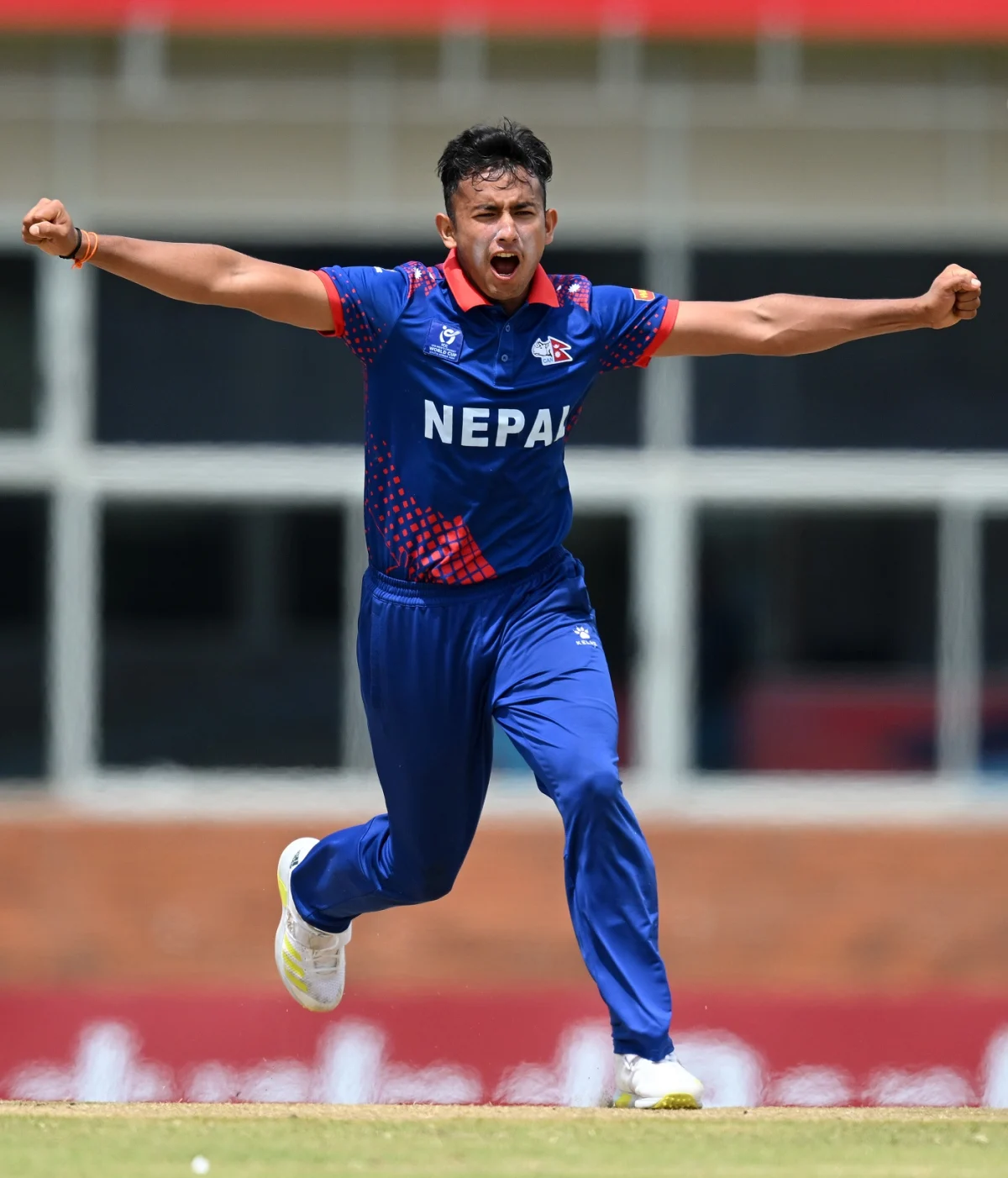 Aakash Chand of Nepal celebrates the wicket of Afghanistan during the ICC U19 Men's Cricket World Cup South Africa 2024 match between Afghanistan and Nepal at Buffalo Park on January 26, 2024 in East London, South Africa.