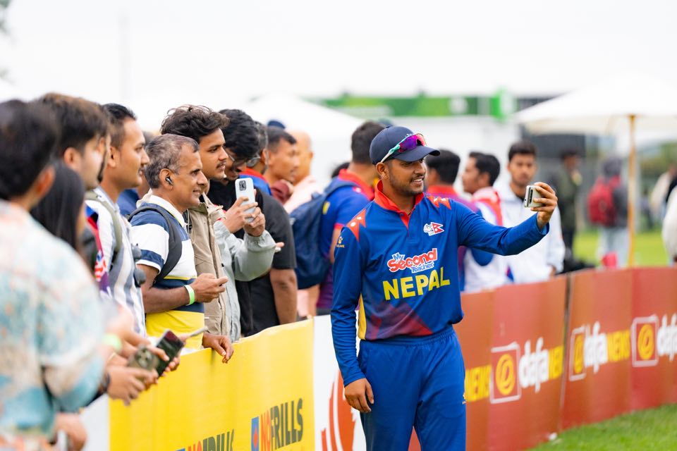 Sandeep Lamichhane with fans during the match
